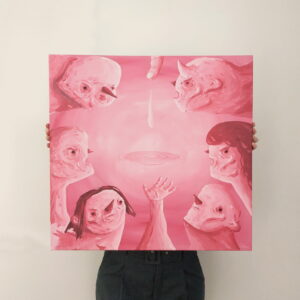 holding a piece of art