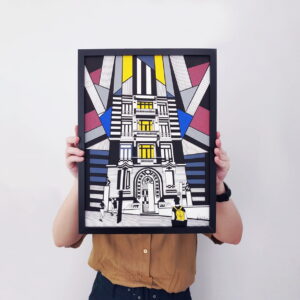 holding a piece of art